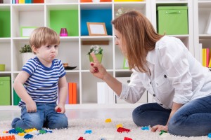 Angry mother scolding a disobedient child